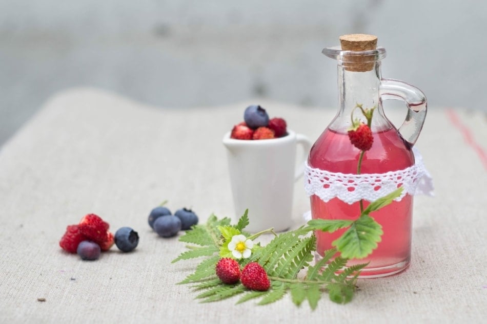 Bottle of strawberry vinegar made with strawberry tops