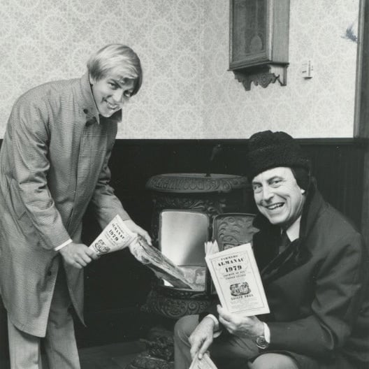 Peter Geiger with his father Ray Geiger holding copies of Farmers' Almanac.