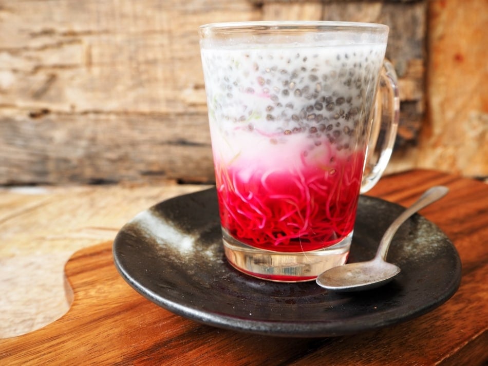 Falooda Indian dessert in a glass with basil seeds.