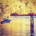 person fly fishing, close up of a fly