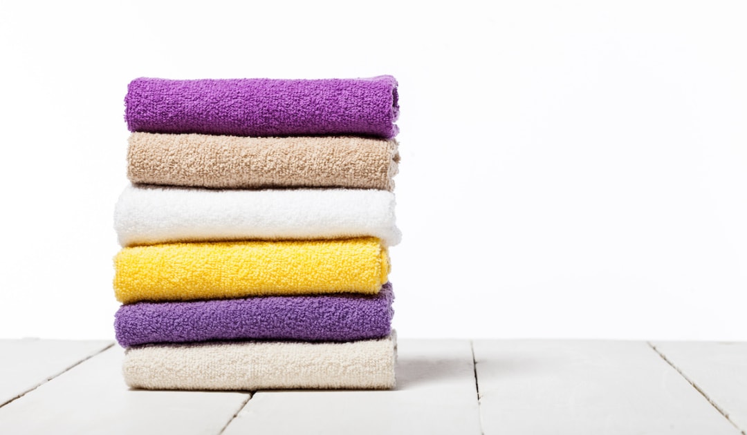 stack of colorful folded towels laundry