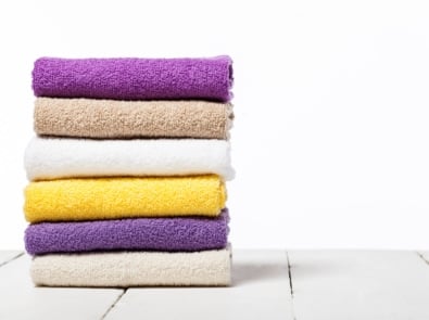 stack of colorful folded towels laundry