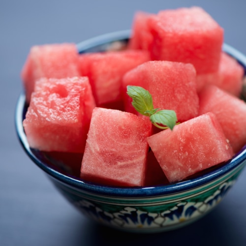 Watermelon chunks in a decorative bowl.