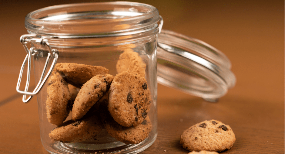 Chocolate chip cookies in a jar with clasp.