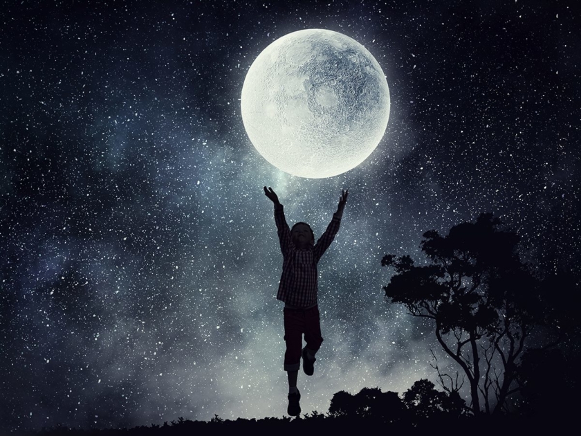 A child reaching towards a full Moon.