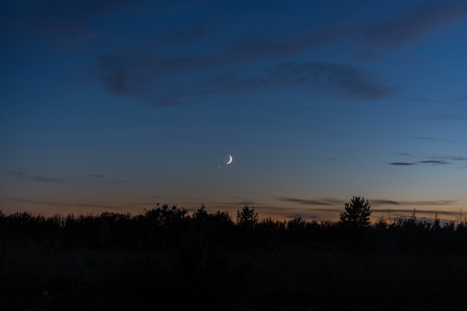 Waxing moon and venus in the dusky sky.