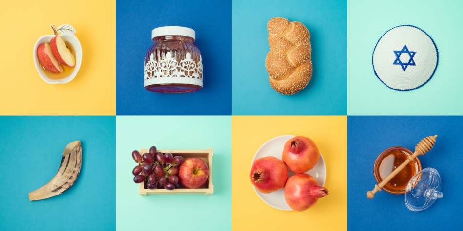Jewish holiday Rosh Hashanah concept with honey, apple and pomegranate. View from above. Flat lay