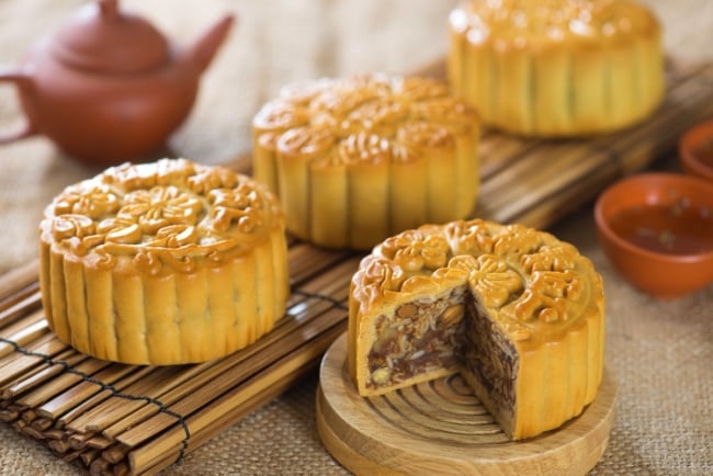 Sliced mixed-nut mooncake with golden lattice top