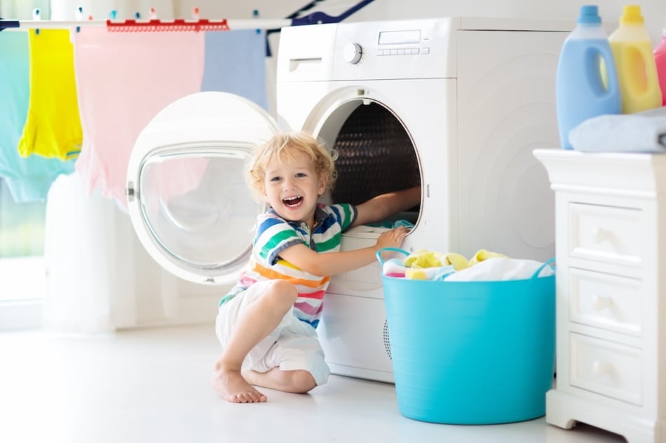 child in the laundry room.