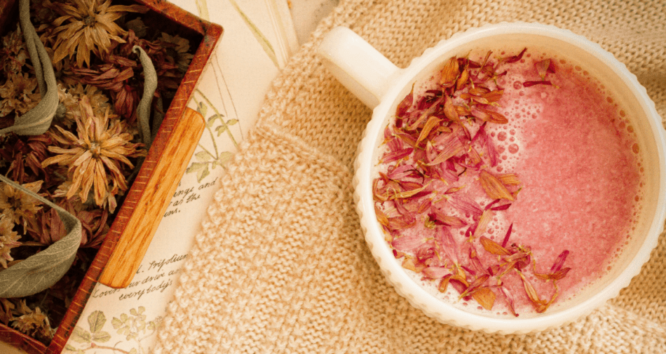 strawberry Moon Milk in a mug with herbs.