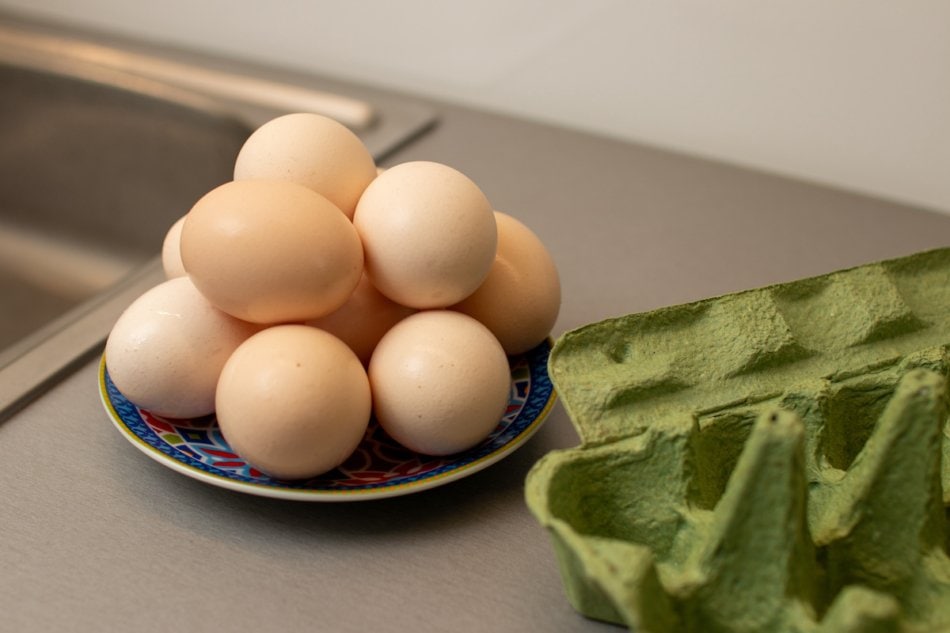 Eggs in a dish on the counter.