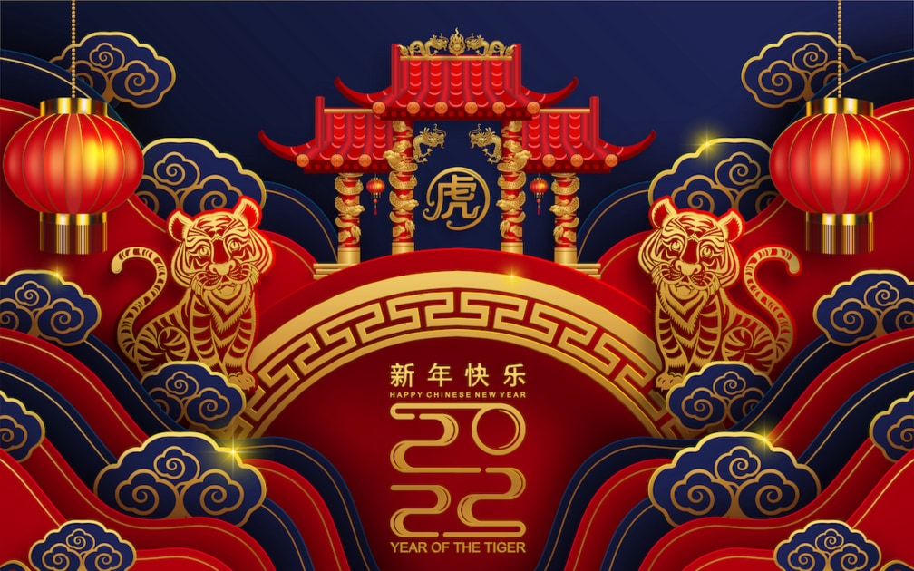 Chinese new year 2022 year of the tiger red and gold flower and asian elements paper cut with craft style on background.( translation : chinese new year 2022, year of tiger.