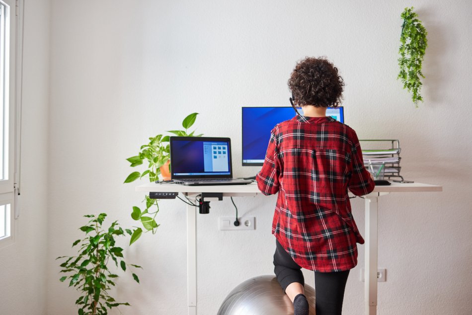 Woman at standing desk.