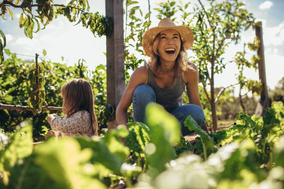 Family working on allotment together.