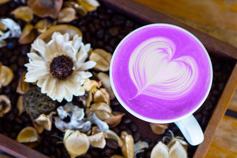 Taro latte art top view on wood table.