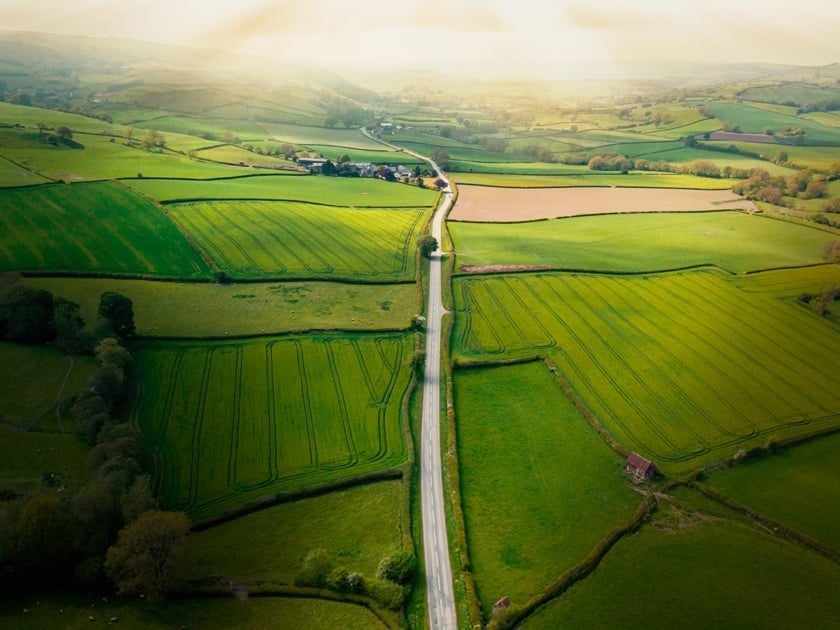 An arial shot of farmland divided into different plots.