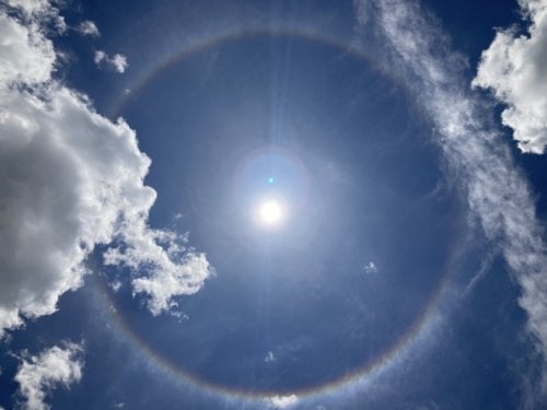 What is the source and the meaning of a large halo around the sun