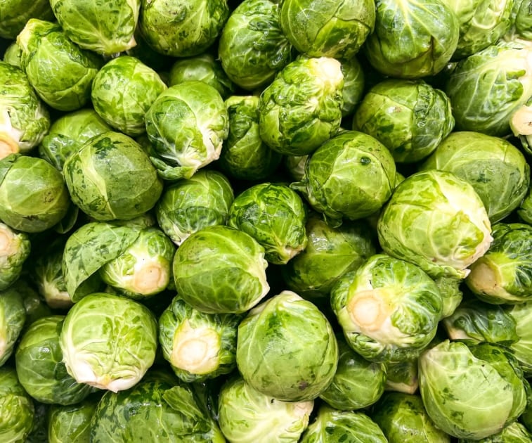 A bunch of whole Brussels sprouts.