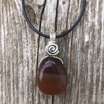 An image of a necklace made with carnelian, an alternative August birthstone.