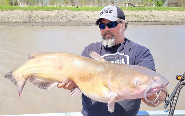 Well known catfishing writer Brad Durick holding a catfish.