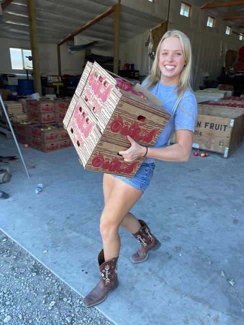 Kaitlyn Thornton filling an apple order at Kait's Crates in Washington. 