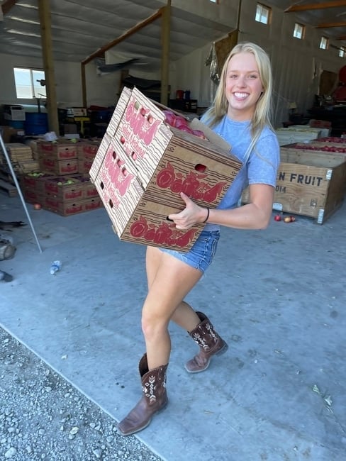 Apple Girl carrying fall apples.