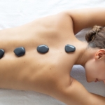 Heat therapy using hot stones.