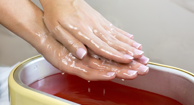 Heated Paraffin Wax Treatment is one form of heat therapy that treats pain.