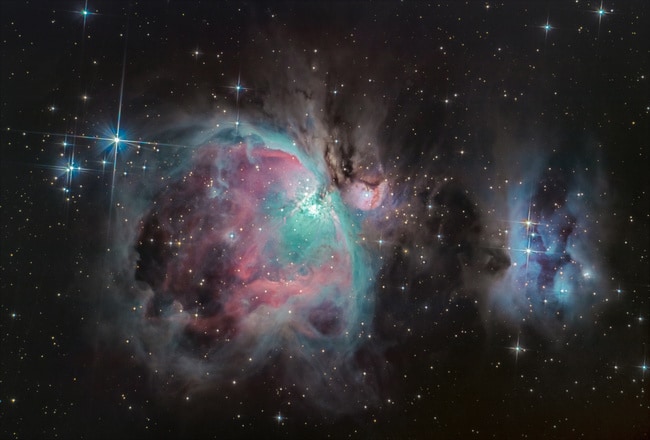 February night sky contains the Orion Nebula.