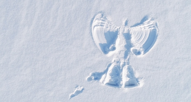 Making snow angels is a fun snow activity.