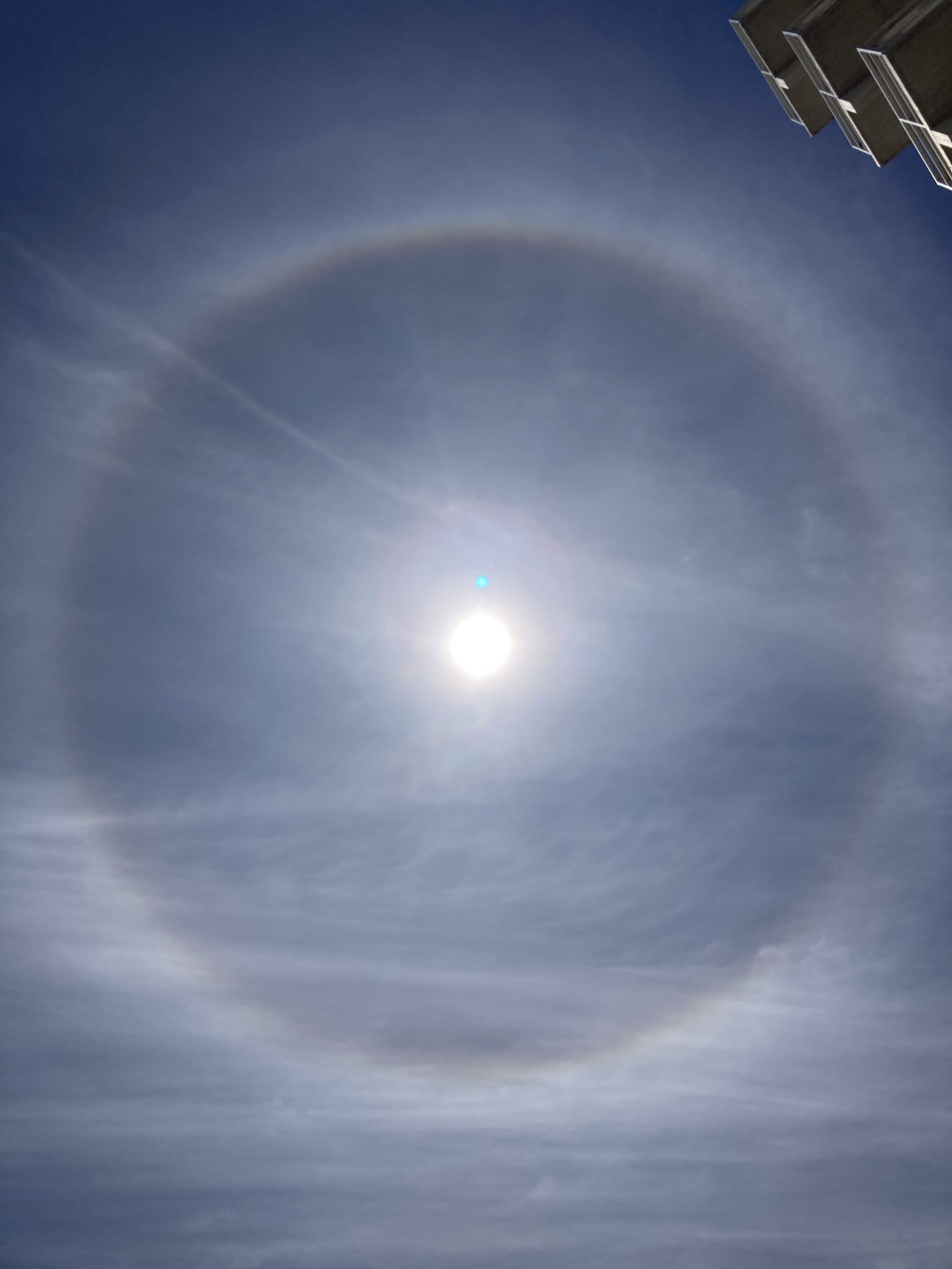 What is the source and the meaning of a large halo around the sun