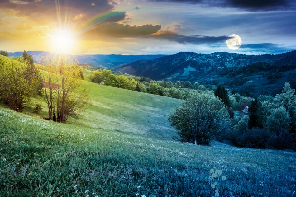 Spring equinox above rural landscape in mountains.