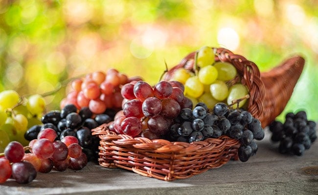 A cornucopia with grapes spilling out.