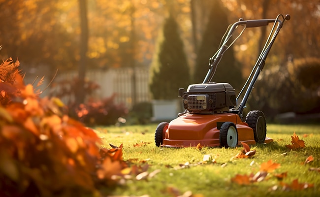 Lawn mower in fall to represent how to winterize lawn mower guide.