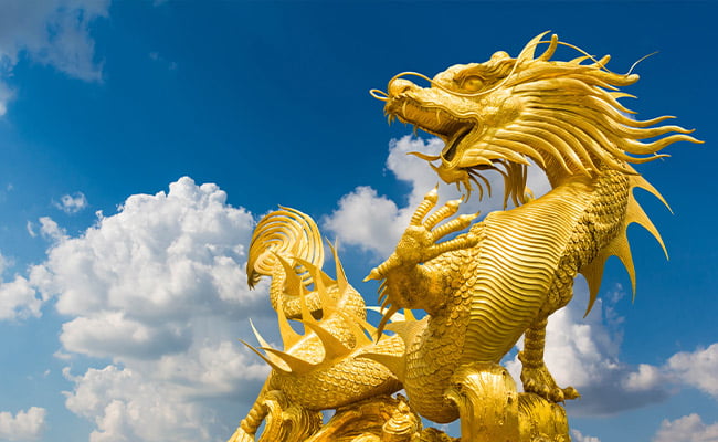 A golden dragon statue representing year of the dragon 2024.
