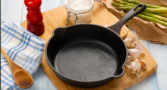 A clean cast iron skillet ready for cooking your next recipe.