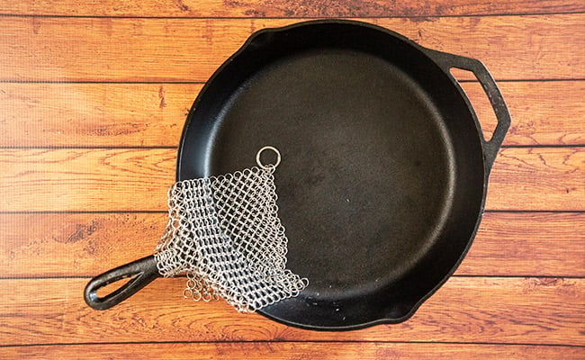 Cast iron pan with chainmail scrubber.