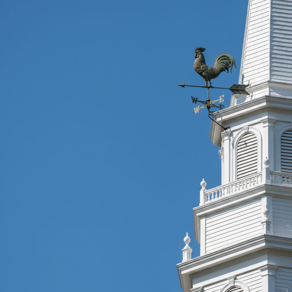 Antique copper rooster weathervane on a New England church steeple