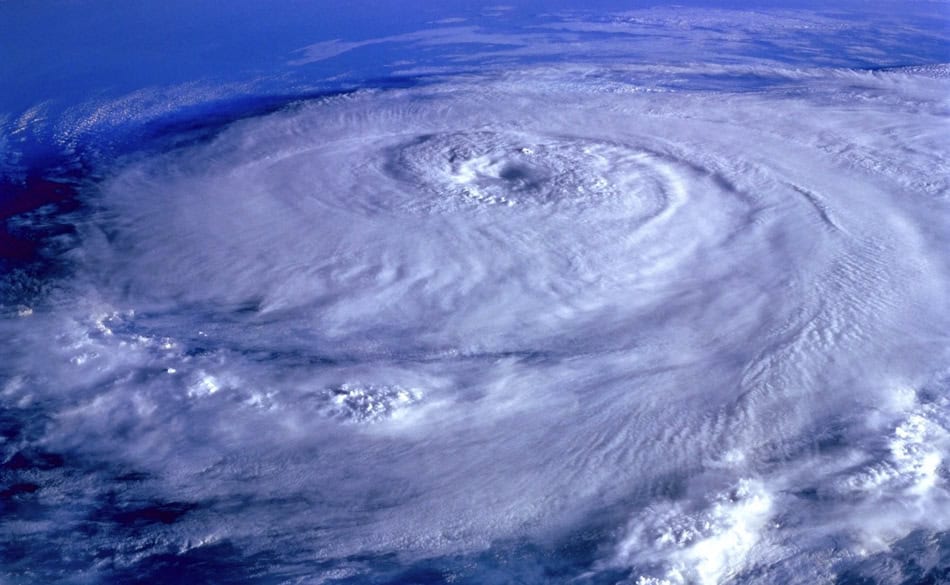 Satellite image of a powerful hurricane with a clear eye and swirling clouds.