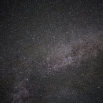 Clear night sky filled with stars and the Milky Way galaxy.